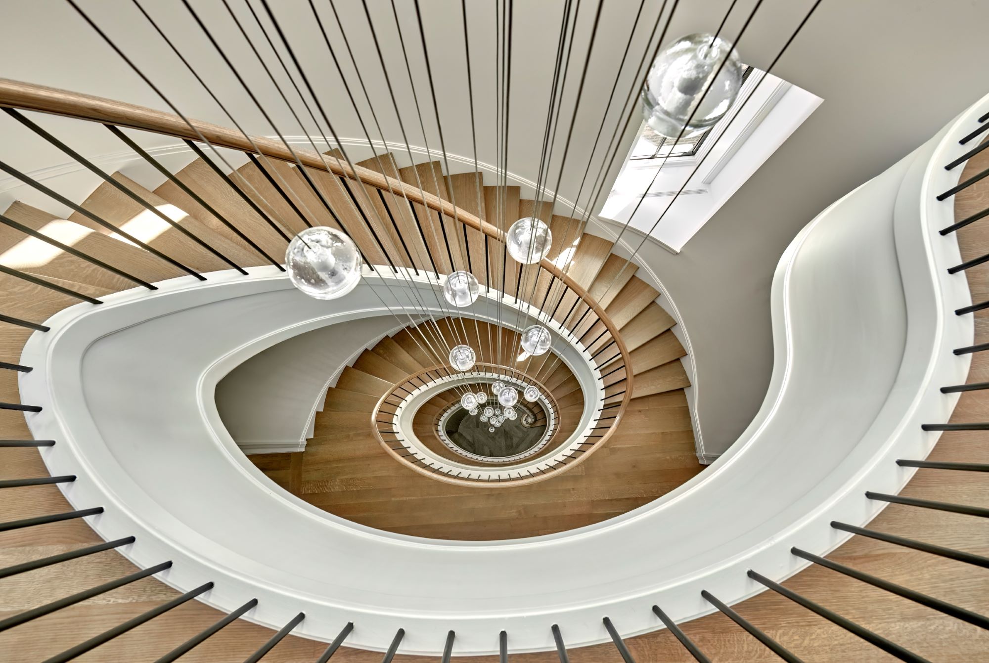 Artistic view looking down at the oval staircase