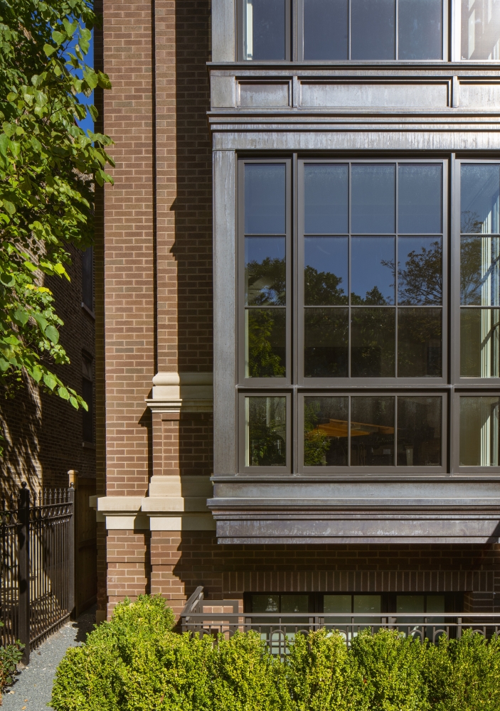 View of the left front half of the house focusing on the large window