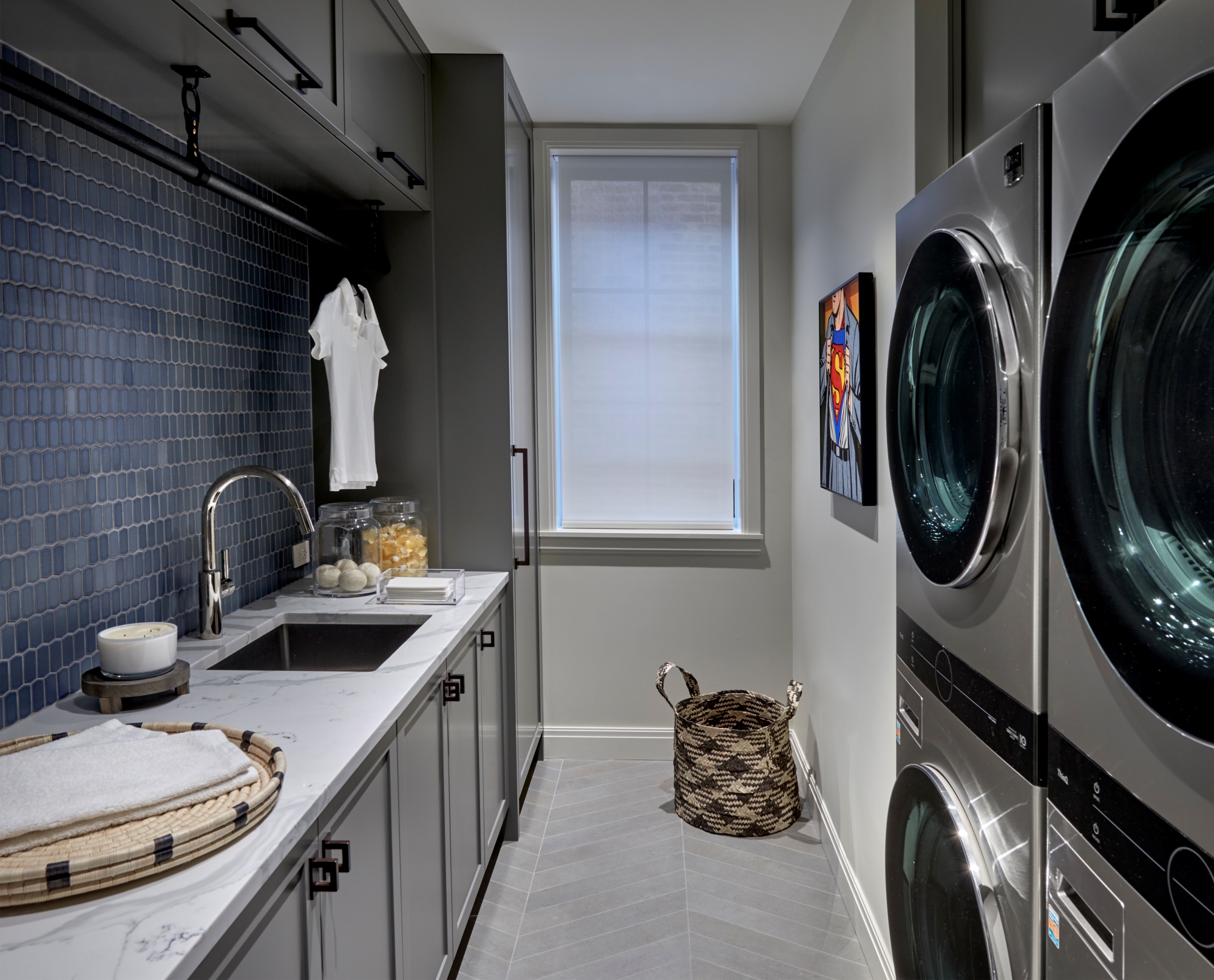 Interior laundry room sink with blue tile backsplash